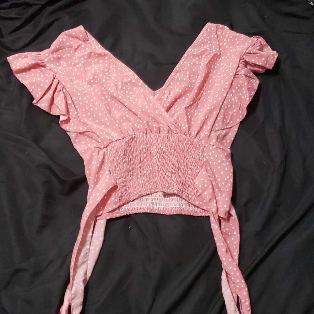 Women's ruffled pink polka-dot top